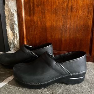 Dansko clogs.  Worn in classroom a couple of times but toooooooo snug for me!